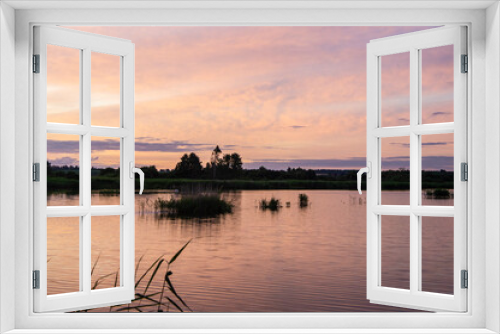 Fototapeta Naklejka Na Ścianę Okno 3D - Beautiful pink vibrant sunset on a forest lake