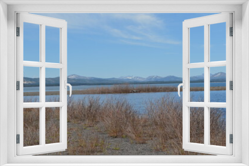 Fototapeta Naklejka Na Ścianę Okno 3D - Spring in Yellowstone National Park: Looking Across Yellowstone Lake From Gull Point to Sulphur Hills and Pelican Cone, Saddle Mountain, Castor Peak, Pollux Peak and Pyramid Peak of the Absaroka Range