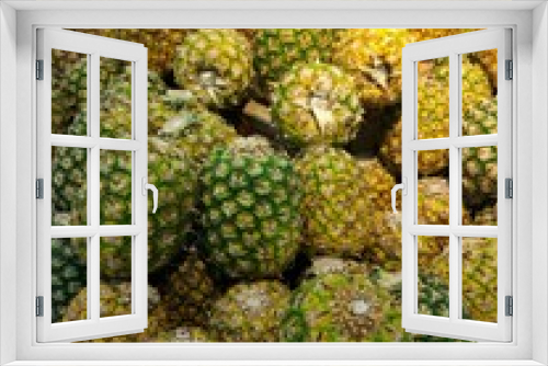 Fototapeta Naklejka Na Ścianę Okno 3D - A lot of pineapple fruit at market store. Tropical fruit background