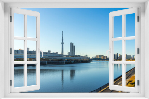 Tokyo Skytree with blue sky background and Sumida river as foreground in Tokyo, Japan 