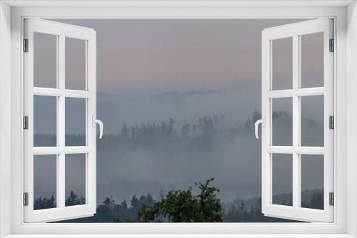Fototapeta Naklejka Na Ścianę Okno 3D - Panoramic view to forest silhouette with misty fog. Czech landscape