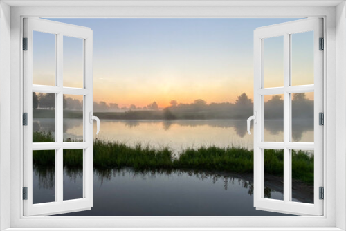 Fototapeta Naklejka Na Ścianę Okno 3D - early foggy sunrise on golf course pond leaves changing color