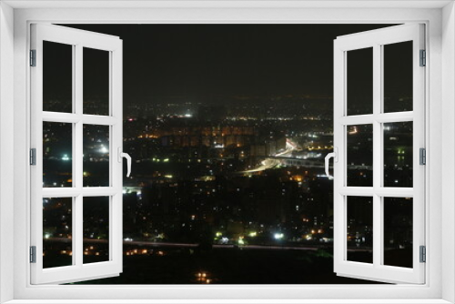 Fototapeta Naklejka Na Ścianę Okno 3D - Cityscape night over mount at Mukattam in Egypt 