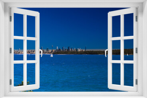 Fototapeta Naklejka Na Ścianę Okno 3D - Panoramic view of Sydney Harbour in NSW Australia on a cold winters day blue skies with CBD in the background
