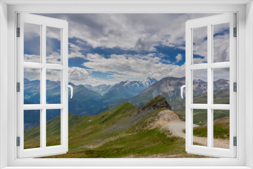 Fototapeta Naklejka Na Ścianę Okno 3D - summer landscape in Austria with fresh green mountain pastures and snow-capped mountain tops in the background, Heiligenblut, Austria