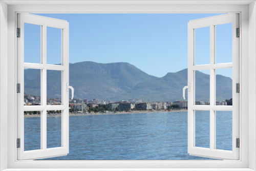 Fototapeta Naklejka Na Ścianę Okno 3D - Alanya, TURKEY - August 10, 2013: Travel to Turkey. The waves of the Mediterranean Sea. Water surface. Port. Ships on the water. Boats at sea. Yachts and other water transport. Mountains in the backgr