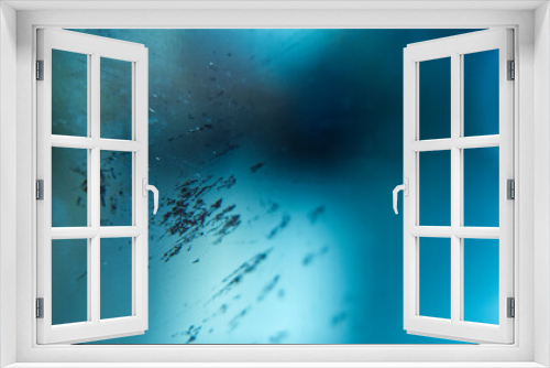 Fototapeta Naklejka Na Ścianę Okno 3D - Abstract blue background with scratched glass, damaged sunglasses
