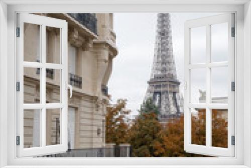 Fototapeta Naklejka Na Ścianę Okno 3D - Autumn city of Paris and its streets overlooking the Eiffel Tower. Trees with yellow leaves.