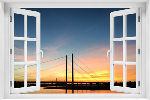 Fototapeta Naklejka Na Ścianę Okno 3D - Colourful sunset on the Rhine with bridge in the background