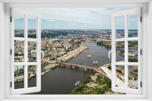 Fototapeta Naklejka Na Ścianę Okno 3D - Aerial drone view. Construction of a bridge across the Dnieper river in Kiev.
