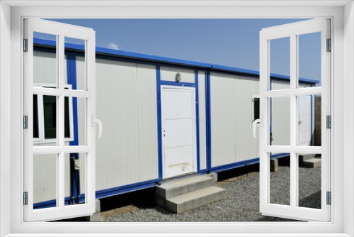 Fototapeta Naklejka Na Ścianę Okno 3D - Portacabin, porta cabin, temporary labours camp , Mobile building in industrial site or office container Portable house and office cabins. Labor Camp. Porta cabin. small temporary houses