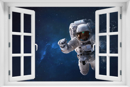 Fototapeta Naklejka Na Ścianę Okno 3D - Astronaut from dust in outer space. Space wallpaper. Elements of this image furnished by NASA