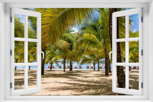 Fototapeta Naklejka Na Ścianę Okno 3D - Coconut palm trees on white sandy beach near South China Sea on island of Phu Quoc, Vietnam. Travel and nature concept