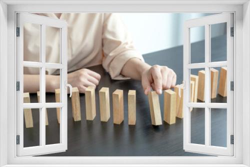 Fototapeta Naklejka Na Ścianę Okno 3D - Hand holding blocks wood game, Concept Risk of management and strategy plan, growth business success process and team work