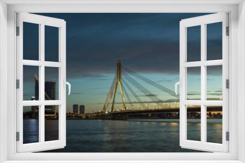 Fototapeta Naklejka Na Ścianę Okno 3D - Cable stayed bridge across Daugava river at night in Riga, Latvia.
