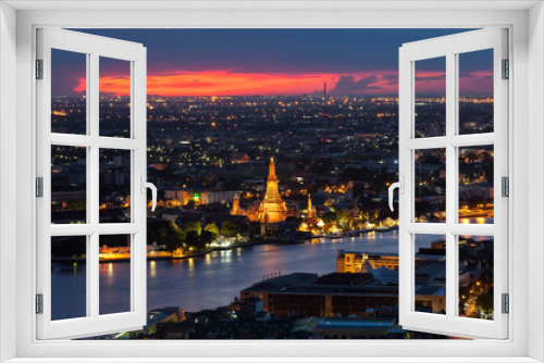 Fototapeta Naklejka Na Ścianę Okno 3D - The beautiful temple along the Chao Phraya river at twilight