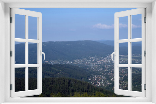 Fototapeta Naklejka Na Ścianę Okno 3D - Bielsko Biala, South Poland: Wide angle from up above panoramic detailed high definition view of scenic mountains, green forest and city against blue sky