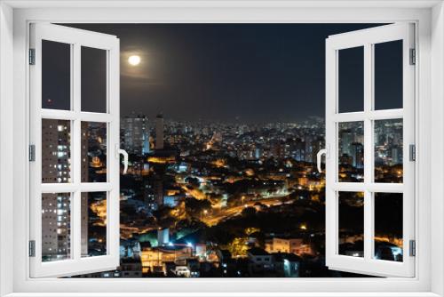 Fototapeta Naklejka Na Ścianę Okno 3D - Foto noturna da cidade incluindo a Lua. 