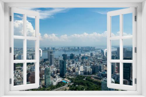Fototapeta Naklejka Na Ścianę Okno 3D - 東京の街並みを見下ろす