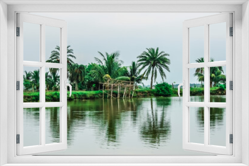 Fototapeta Naklejka Na Ścianę Okno 3D - palm trees in the water