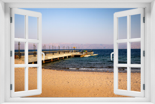 Fototapeta Naklejka Na Ścianę Okno 3D - Pier on beach, daylight pier, Beach view, umbrella on beach, cheers on beach 