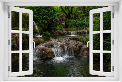 Fototapeta Naklejka Na Ścianę Okno 3D - Waterfall in the forest at Krushuna Waterfalls