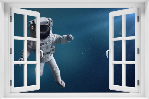 Fototapeta Naklejka Na Ścianę Okno 3D - astronaut in empty space lit by the stars