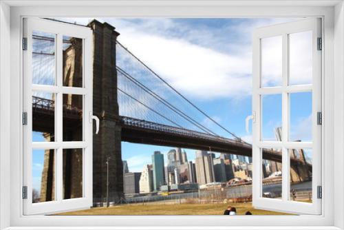 Fototapeta Naklejka Na Ścianę Okno 3D - Famous Brooklyn Bridge in New York City, USA with beautiful blue sky, in black and white, monochrome, Manhattan, USA. 