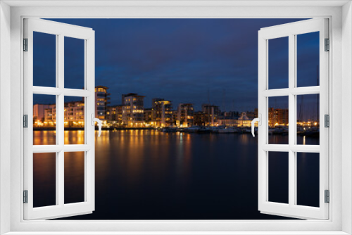 Fototapeta Naklejka Na Ścianę Okno 3D - North harbour with luxury apartments in the coastal city Helsingborg during night-time.