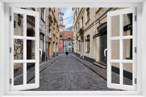 Fototapeta Naklejka Na Ścianę Okno 3D - Picturesque street in Old Town of Riga, colorful, well preserved , historic buildings , cobble stones paved and winding narrow street, Riga, Latvia.