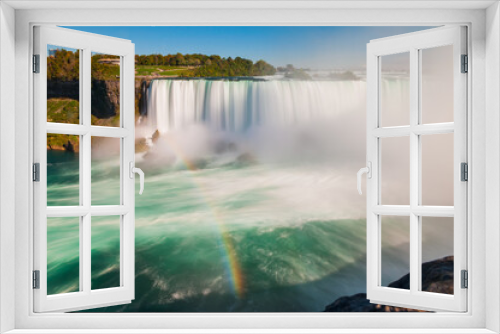 Fototapeta Naklejka Na Ścianę Okno 3D - Rainbow over the Niagara Falls Waterfall. Colorful view from Canada side on Niagara with blurred shot. Unique landscape on the Canada and USA border.