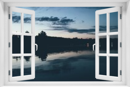 Fototapeta Naklejka Na Ścianę Okno 3D - Blue-toned lake and sky scene