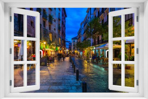Fototapeta Naklejka Na Ścianę Okno 3D - Old street in Madrid, Spain. Architecture and landmark of Madrid. Night cityscape of Madrid.