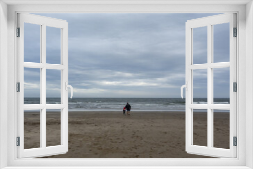 Fototapeta Naklejka Na Ścianę Okno 3D - Father and son, walking in the sand to the horizon (far)