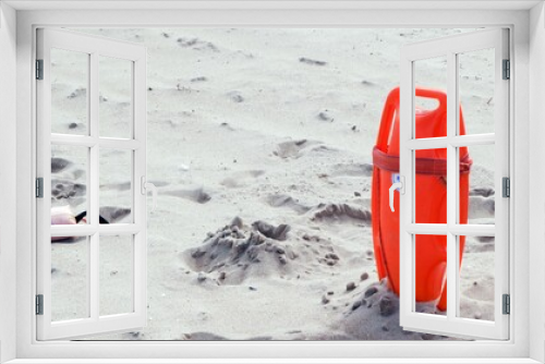 Fototapeta Naklejka Na Ścianę Okno 3D - Lifeguard board stuck in the sand on the beach, ready for rescue.