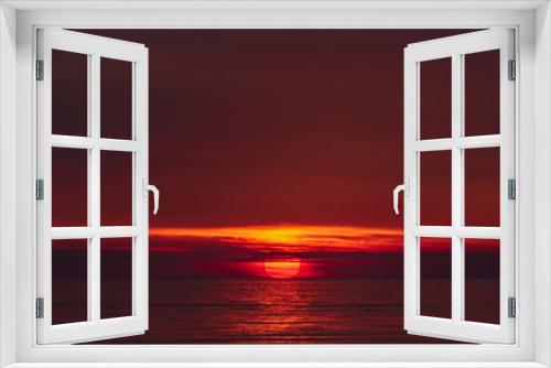 Fototapeta Naklejka Na Ścianę Okno 3D - the moment of sunset when the sun touches the horizon