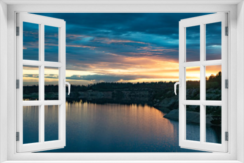 Fototapeta Naklejka Na Ścianę Okno 3D - Sunset over a large lake in nature in summer.