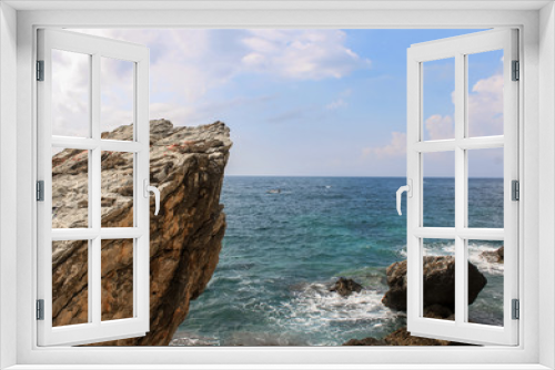 Fototapeta Naklejka Na Ścianę Okno 3D - Big rocks in the middle of the sea or ocean with great blue raging water waves breaking on a stone. Mogren Budva in Montenegro Beach. Relaxing on the nature. Tourism in Europe, ocean and sea vacations