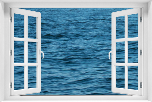 Fototapeta Naklejka Na Ścianę Okno 3D - A Shot of a Deep Blue Colored Ocean That Fills the Frame