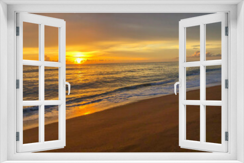 Fototapeta Naklejka Na Ścianę Okno 3D - Bright sunset over the ocean with a golden sky and reflections on water