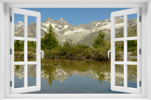 Fototapeta Naklejka Na Ścianę Okno 3D - Mountain landscape with a lake over Zermatt in the Swiss alps