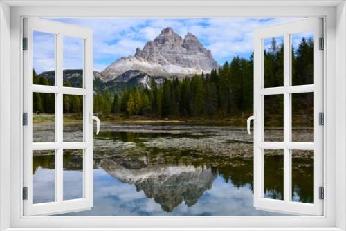 Fototapeta Naklejka Na Ścianę Okno 3D - Tre Cime (Three Peaks) di Lavaredo Natural Park, Dolomites mountains, South Tirol, Italy, a lake in front, reflections on water surface, autumn landscape, blue sky with clouds background, a sunny day
