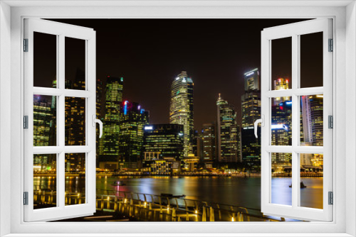 Fototapeta Naklejka Na Ścianę Okno 3D - Metropolitan Singapore Skyline Illuminates at Night on Marina Bay