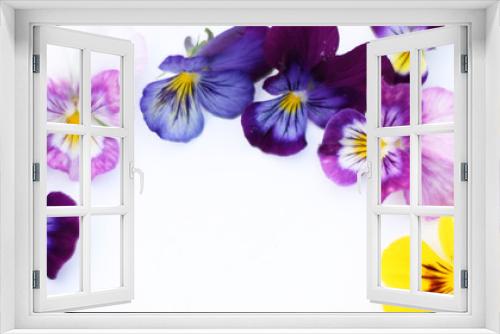 Fototapeta Naklejka Na Ścianę Okno 3D - Round Frame with flowers and leaves. Top view background with pansy flowers. Flowers composition. Mock up with plants. Flat lay with flowers on white table. Banner size. Copyspace for text.