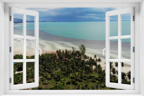 Fototapeta Naklejka Na Ścianę Okno 3D - Unusual coast of white sand. Breathtaking landscape of sandy wavy seaside. Paradise islands in Asia. Drone view, natural idyllic scene, coconut palms on the beach. Thunderstorm in the tropics.