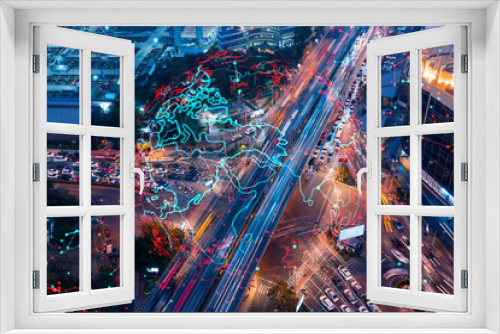 Fototapeta Naklejka Na Ścianę Okno 3D - World planet Earth map hologram on aerial view of road, busy urban traffic highway at night. Junction network of transportation infrastructure. The concept of success in logistics business.