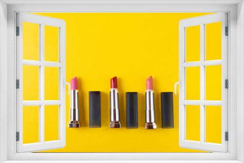Fototapeta Naklejka Na Ścianę Okno 3D - female bright lipsticks on mono colour yellow background