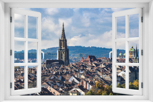 Fototapeta Naklejka Na Ścianę Okno 3D - Stunning aerial view of Bern old town with Bern Minster (Münster) cathedral and Swiss Federal Palace (Bundeshaus), from Rosengarten on sunny autumn day, Switzerland
