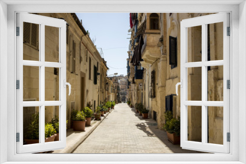 Fototapeta Naklejka Na Ścianę Okno 3D - A quaint narrow street in Valletta, Malta