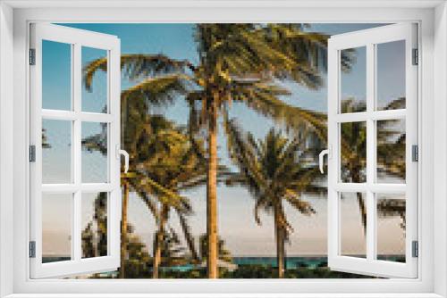 Fototapeta Naklejka Na Ścianę Okno 3D - Sunset view at paradise beachwith beach palms in Tulum, Quintana Roo, Mexico.